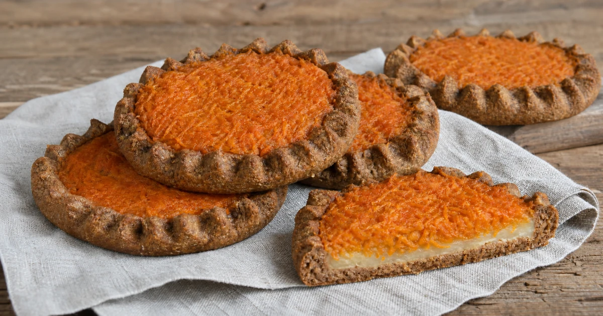 Traditional Latvian sklandrausis rye tarts with carrot filling