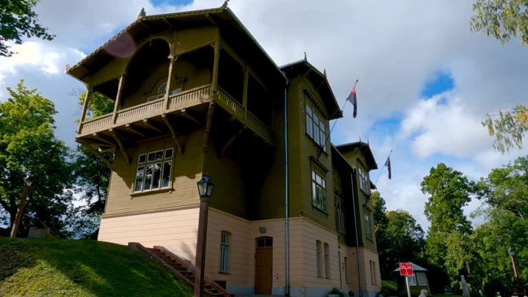 Villa Bangert, home of Kuldīga District Museum, beneath a blue sky