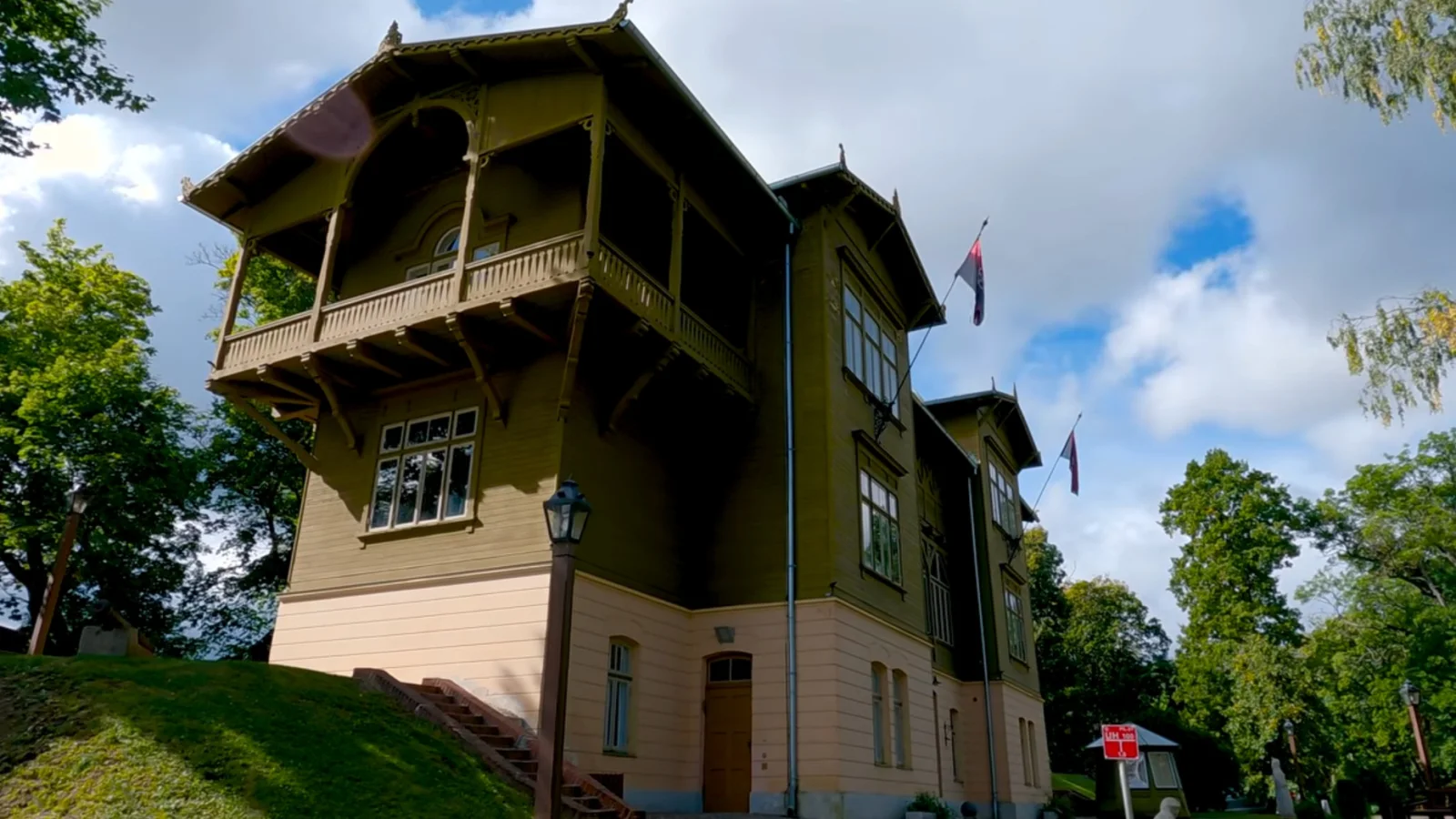 Villa Bangert, home of Kuldīga District Museum, beneath a blue sky