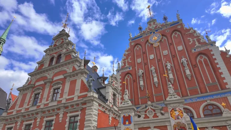 House of the Black Heads in Riga Town Hall Square beneath a blue sky